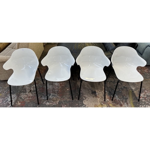 1120 - Four Italian Calligaris Saint Tropez white plastic and black tubular metal dining chairs