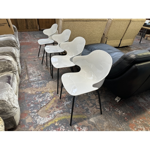 1120 - Four Italian Calligaris Saint Tropez white plastic and black tubular metal dining chairs