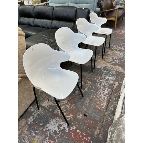 1120 - Four Italian Calligaris Saint Tropez white plastic and black tubular metal dining chairs