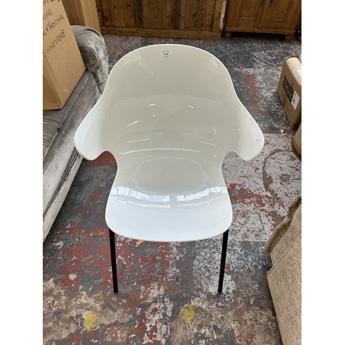 1120 - Four Italian Calligaris Saint Tropez white plastic and black tubular metal dining chairs