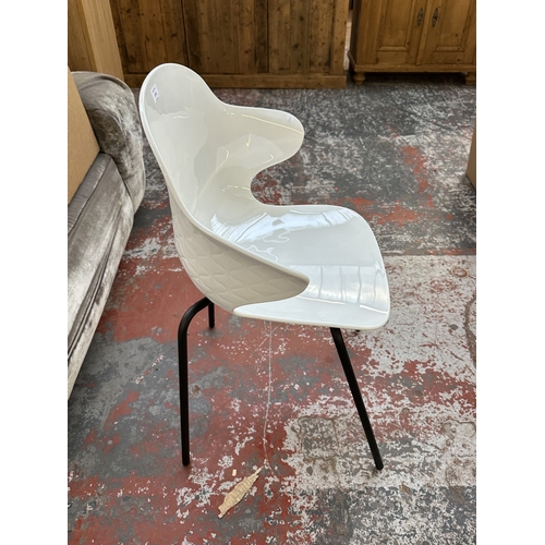 1120 - Four Italian Calligaris Saint Tropez white plastic and black tubular metal dining chairs