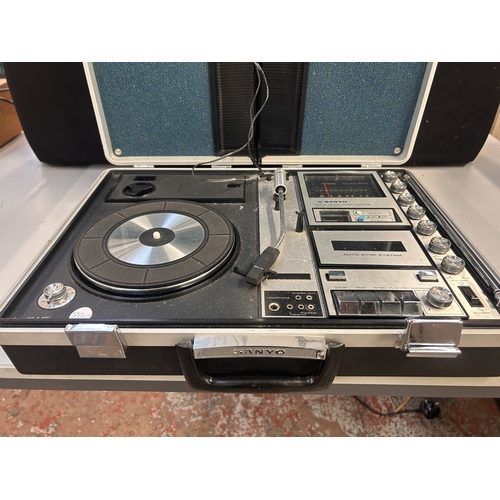 A Sanyo G-2615N-2 portable solid-state music centre comprising three ...