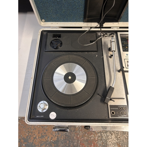 A Sanyo G-2615N-2 portable solid-state music centre comprising three ...