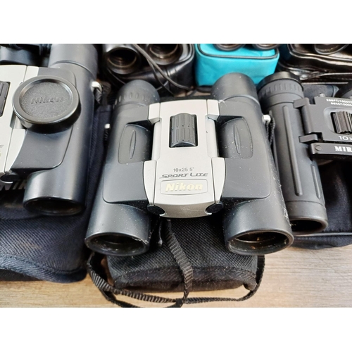 204 - Twenty-three cased pairs of pocket binoculars to include Nikon 7x20 CF III, two Nikon Sport Lite 10x... 
