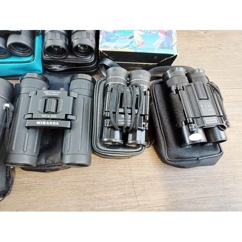 204 - Twenty-three cased pairs of pocket binoculars to include Nikon 7x20 CF III, two Nikon Sport Lite 10x... 
