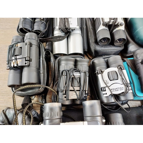 204 - Twenty-three cased pairs of pocket binoculars to include Nikon 7x20 CF III, two Nikon Sport Lite 10x... 