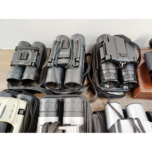 204 - Twenty-three cased pairs of pocket binoculars to include Nikon 7x20 CF III, two Nikon Sport Lite 10x... 
