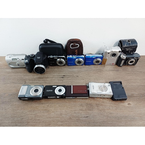 214 - Eleven Fujifilm FinePix digital cameras to include AX650 16mp compact, S5700 7.1mp CCD sensor bridge... 