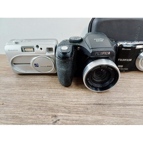214 - Eleven Fujifilm FinePix digital cameras to include AX650 16mp compact, S5700 7.1mp CCD sensor bridge... 