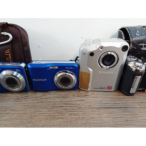214 - Eleven Fujifilm FinePix digital cameras to include AX650 16mp compact, S5700 7.1mp CCD sensor bridge... 