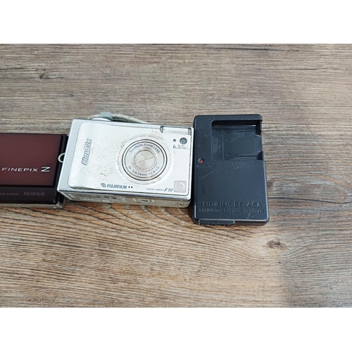 214 - Eleven Fujifilm FinePix digital cameras to include AX650 16mp compact, S5700 7.1mp CCD sensor bridge... 