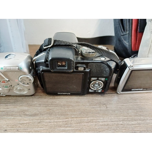 215 - Five Olympus digital cameras to include SZ-30MR 16mp CMOS sensor, µ725SW 7.1mp shock/waterproof, SP-... 
