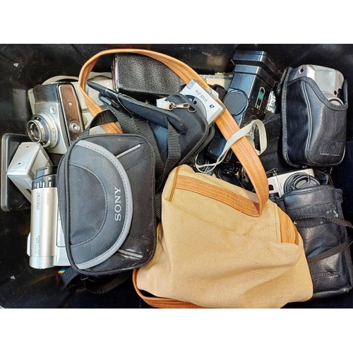 223 - A box containing cameras and photography accessories