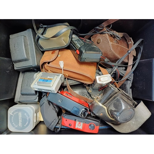 225 - A box containing cameras and photography accessories