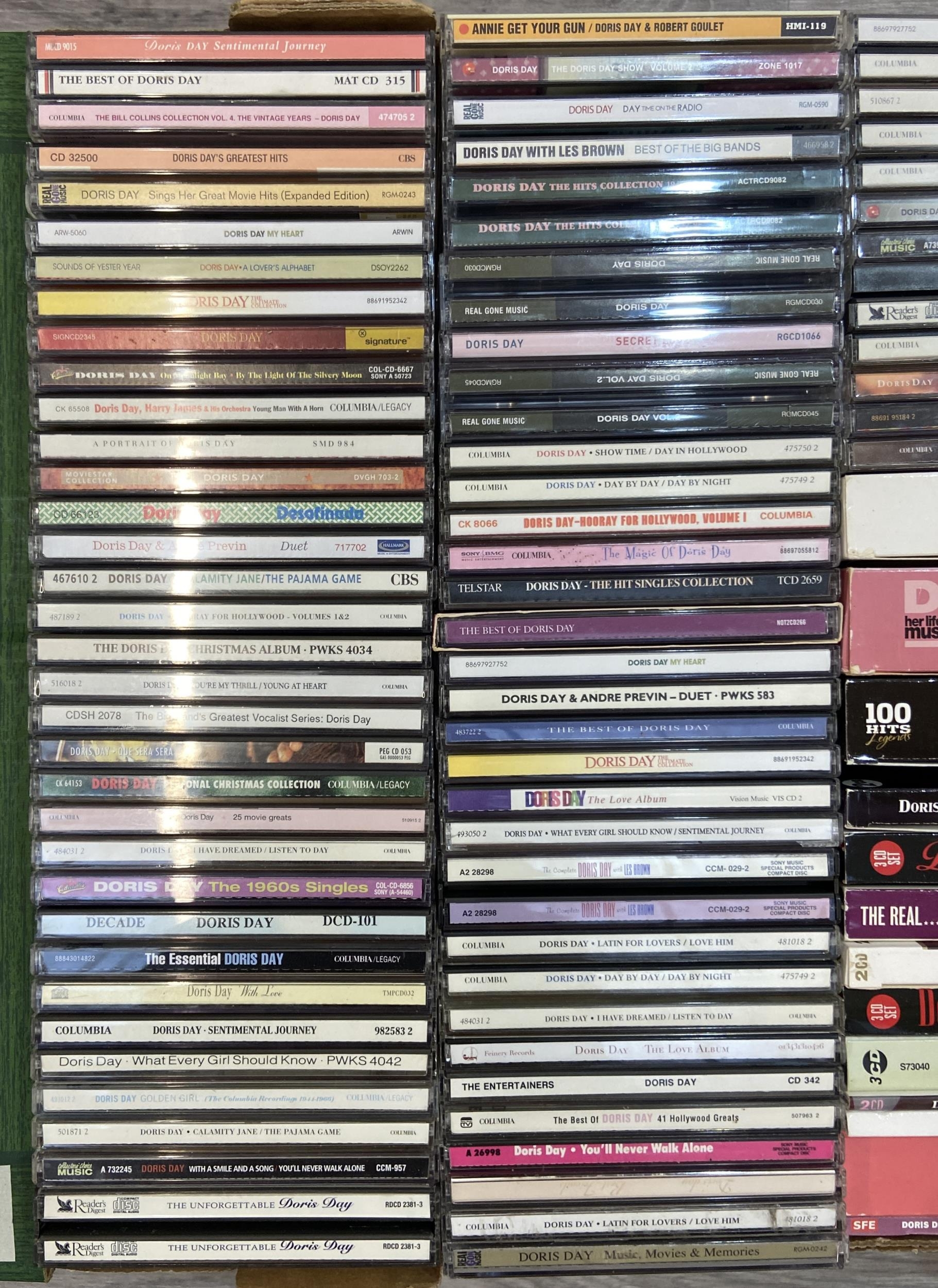 A box containing approx. one hundred CDs by or featuring American ...