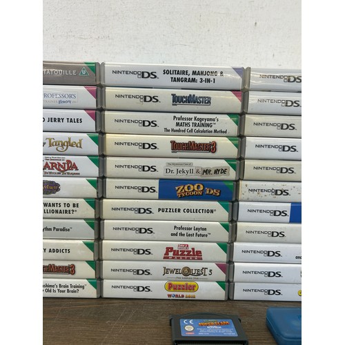 A large collection of Nintendo DS games together with a Nintendo DS ...