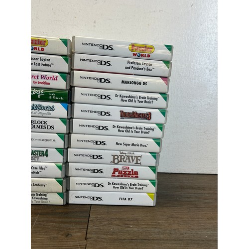 A large collection of Nintendo DS games together with a Nintendo DS ...