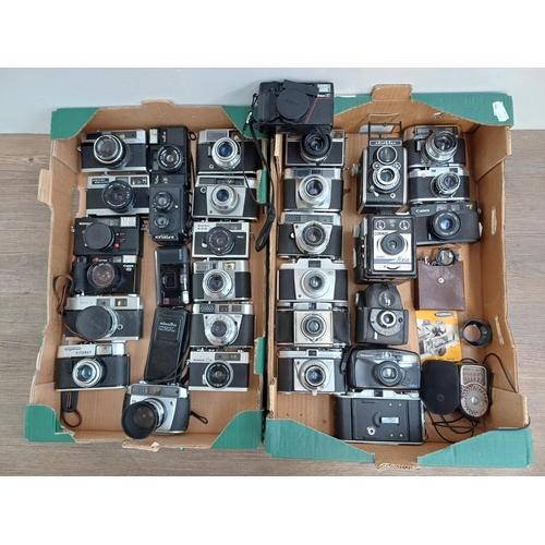 Two boxes containing a collection of vintage cameras to include Canon ...