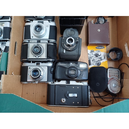 Two boxes containing a collection of vintage cameras to include Canon ...