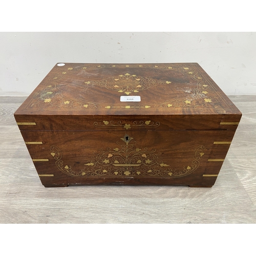 1110 - An Indian brass and copper inlaid jewellery box with fitted interior - approx. 20cm high x 38cm wide... 