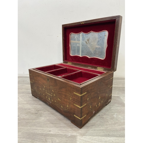 1110 - An Indian brass and copper inlaid jewellery box with fitted interior - approx. 20cm high x 38cm wide... 