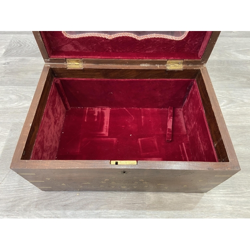 1110 - An Indian brass and copper inlaid jewellery box with fitted interior - approx. 20cm high x 38cm wide... 