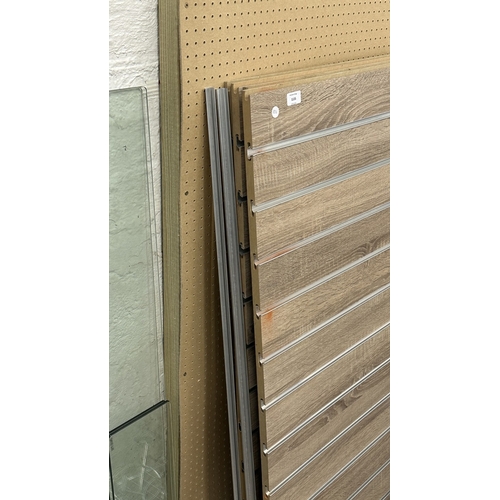 Four modern oak effect shop display boards with various fittings ...