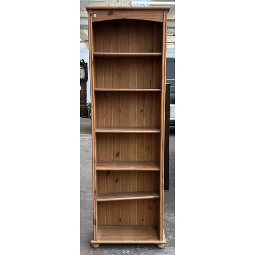 A pine six tier bookcase - approx. 182cm high x 59cm wide x 26cm deep