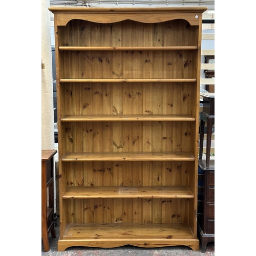 A pine six tier bookcase - approx. 198cm high x 122cm wide x 34cm deep