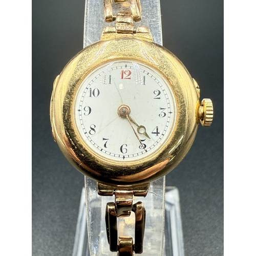 2067F - An early 20th century 15ct gold cased hand wind ladies' wristwatch with 15ct gold expanding bracelet...