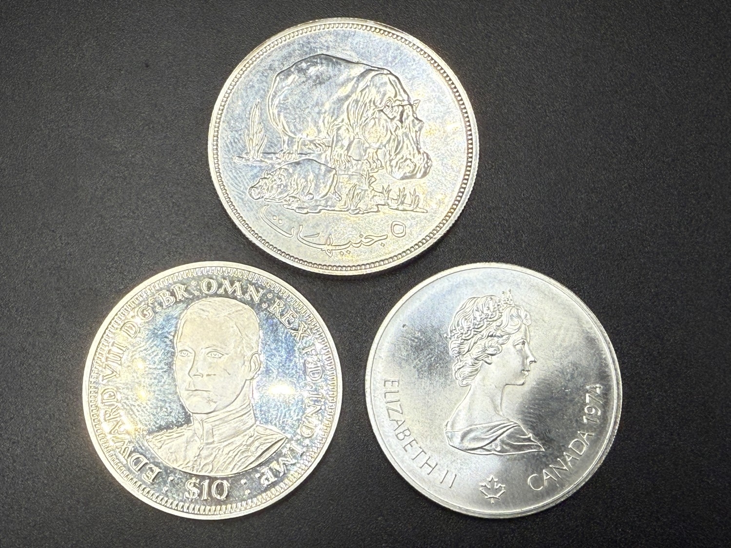 Three 92.5% silver coins, one 1976 Sudan five pounds, one 1974 Canada ...