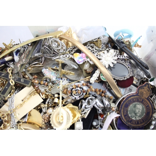 285 - A collection of costume jewellery and accessories to include pin badges, necklaces etc.