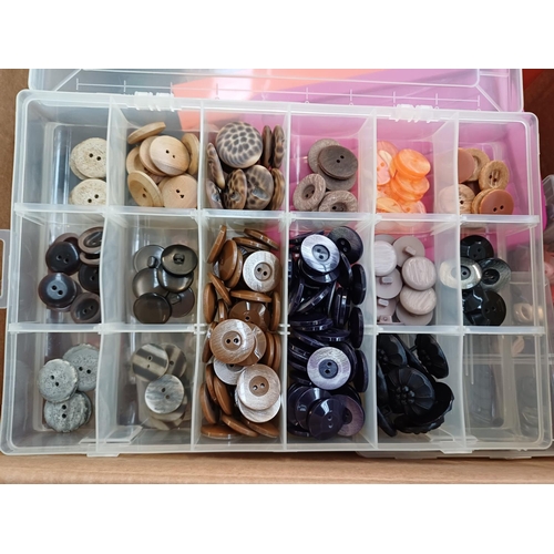 344 - Three boxes containing a very large quantity of buttons