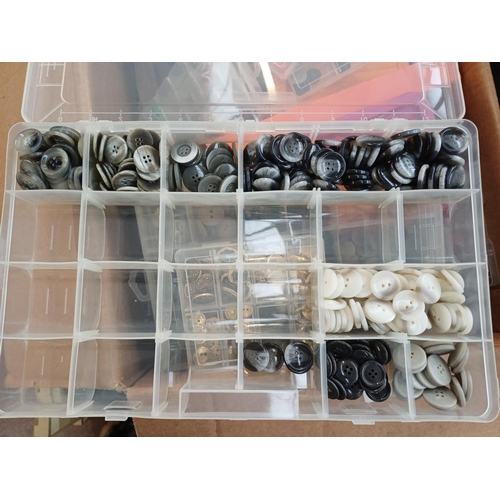 344 - Three boxes containing a very large quantity of buttons
