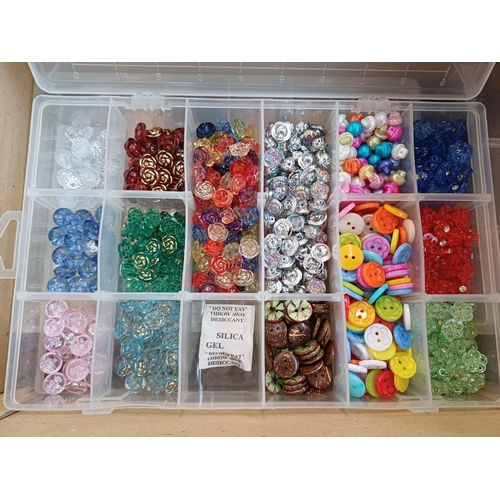 344 - Three boxes containing a very large quantity of buttons