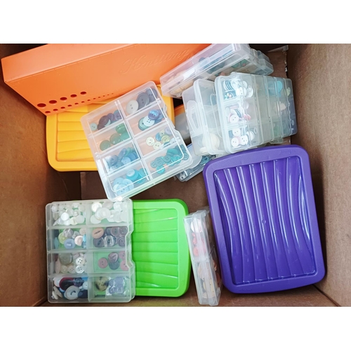 344 - Three boxes containing a very large quantity of buttons