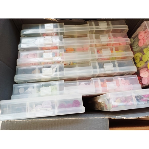 344 - Three boxes containing a very large quantity of buttons