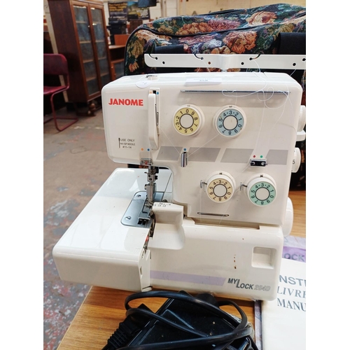 358 - A cased Janome My Lock 204D overlocker with foot pedal and instruction manual