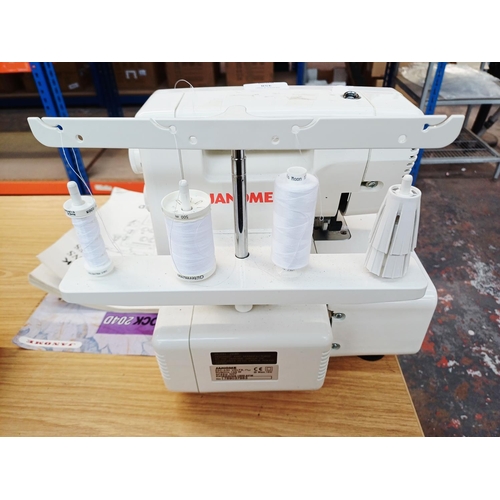 358 - A cased Janome My Lock 204D overlocker with foot pedal and instruction manual