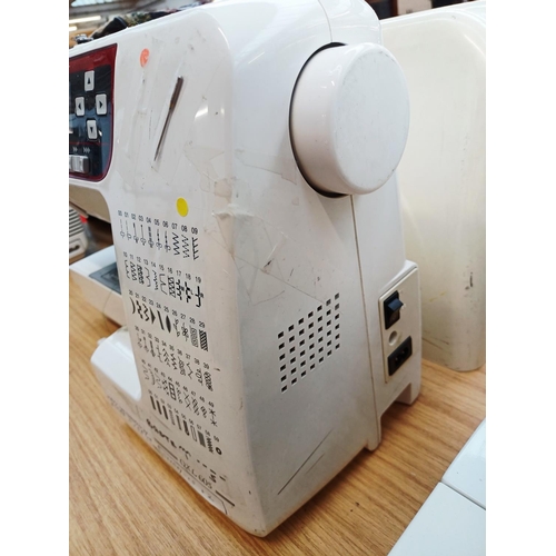 359 - A cased Janome QXL605 electric sewing machine