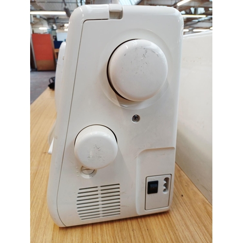 360 - A cased Janome Decor Excel II 5024 electric sewing machine