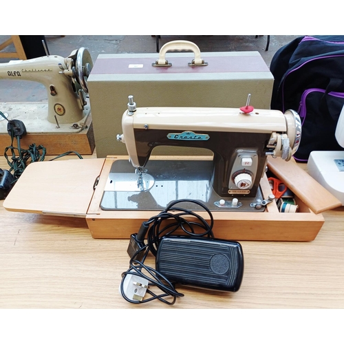 362 - A cased Cresta De Luxe electric sewing machine with foot pedal and accessories