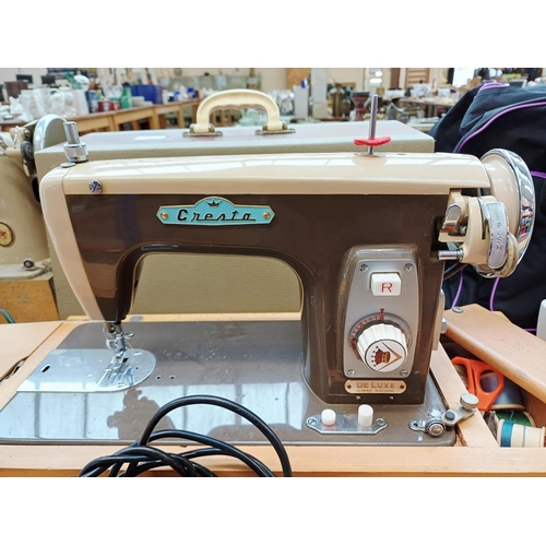 362 - A cased Cresta De Luxe electric sewing machine with foot pedal and accessories