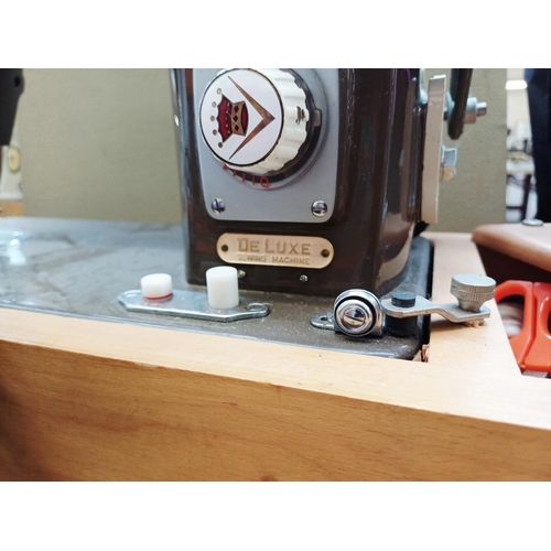 362 - A cased Cresta De Luxe electric sewing machine with foot pedal and accessories
