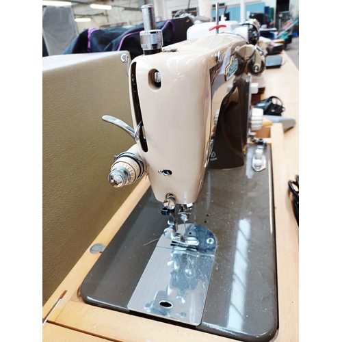 362 - A cased Cresta De Luxe electric sewing machine with foot pedal and accessories