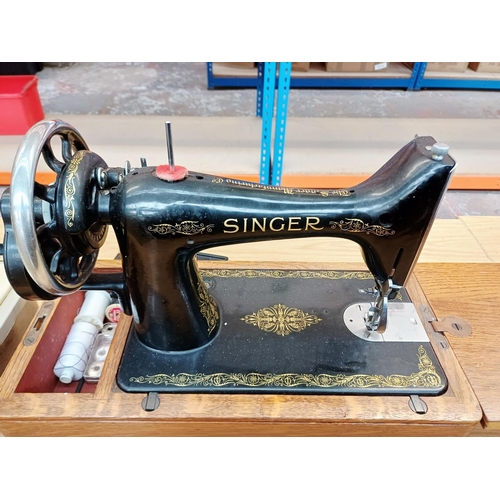364 - A cased 1938 Singer 99K hand-crank sewing machine with accessories