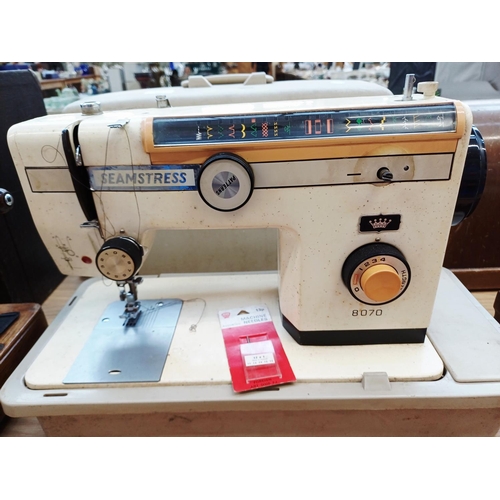 365 - A cased Seamstress 8070 electric sewing machine for spares or repair