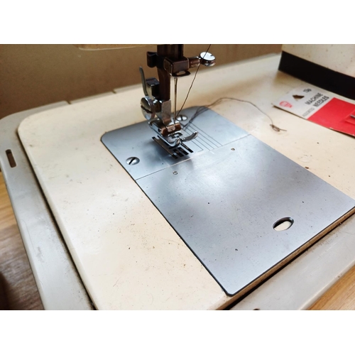365 - A cased Seamstress 8070 electric sewing machine for spares or repair