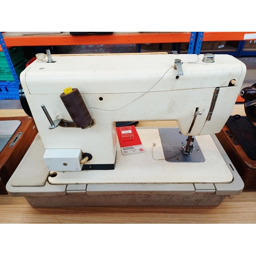 365 - A cased Seamstress 8070 electric sewing machine for spares or repair