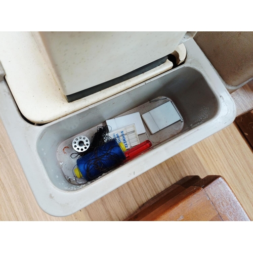 365 - A cased Seamstress 8070 electric sewing machine for spares or repair